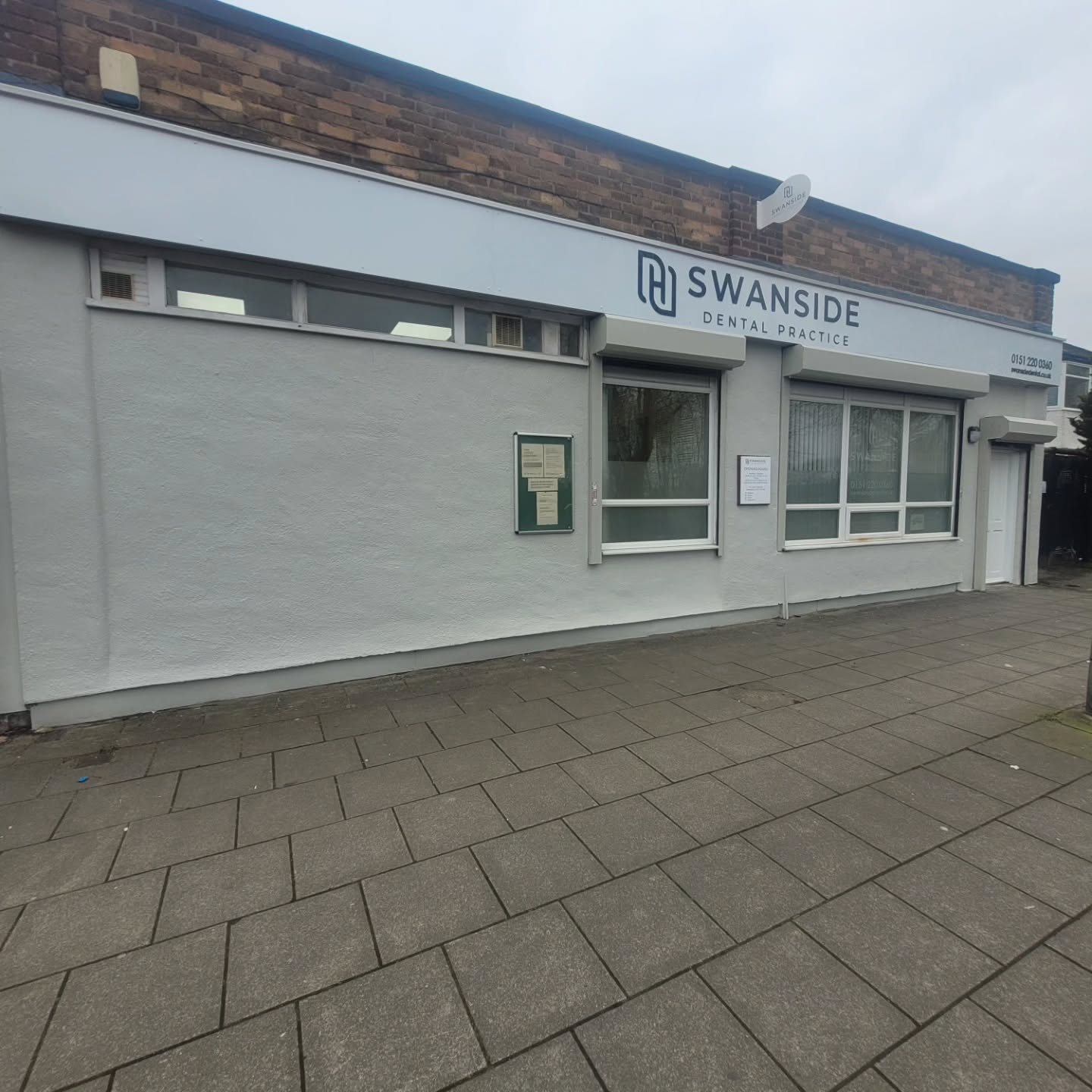 Commercial premises with a freshly painted pale grey exterior